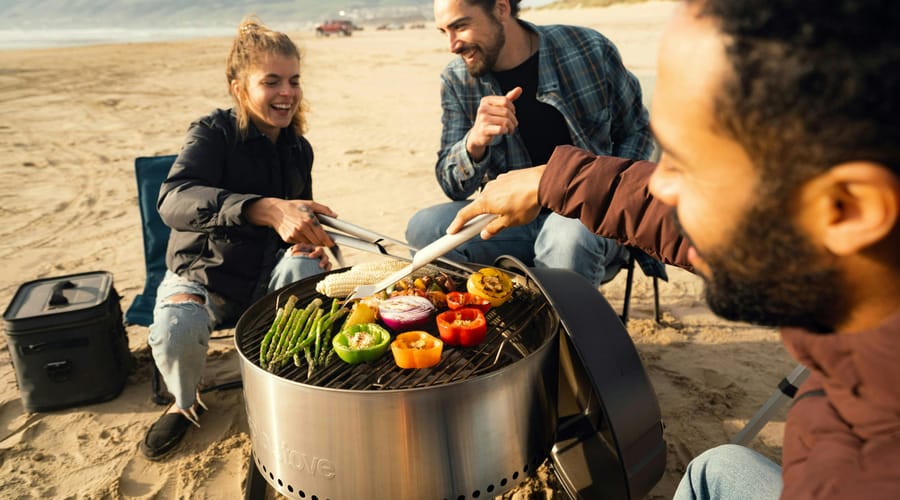 Friend group grilling on an Australian beach