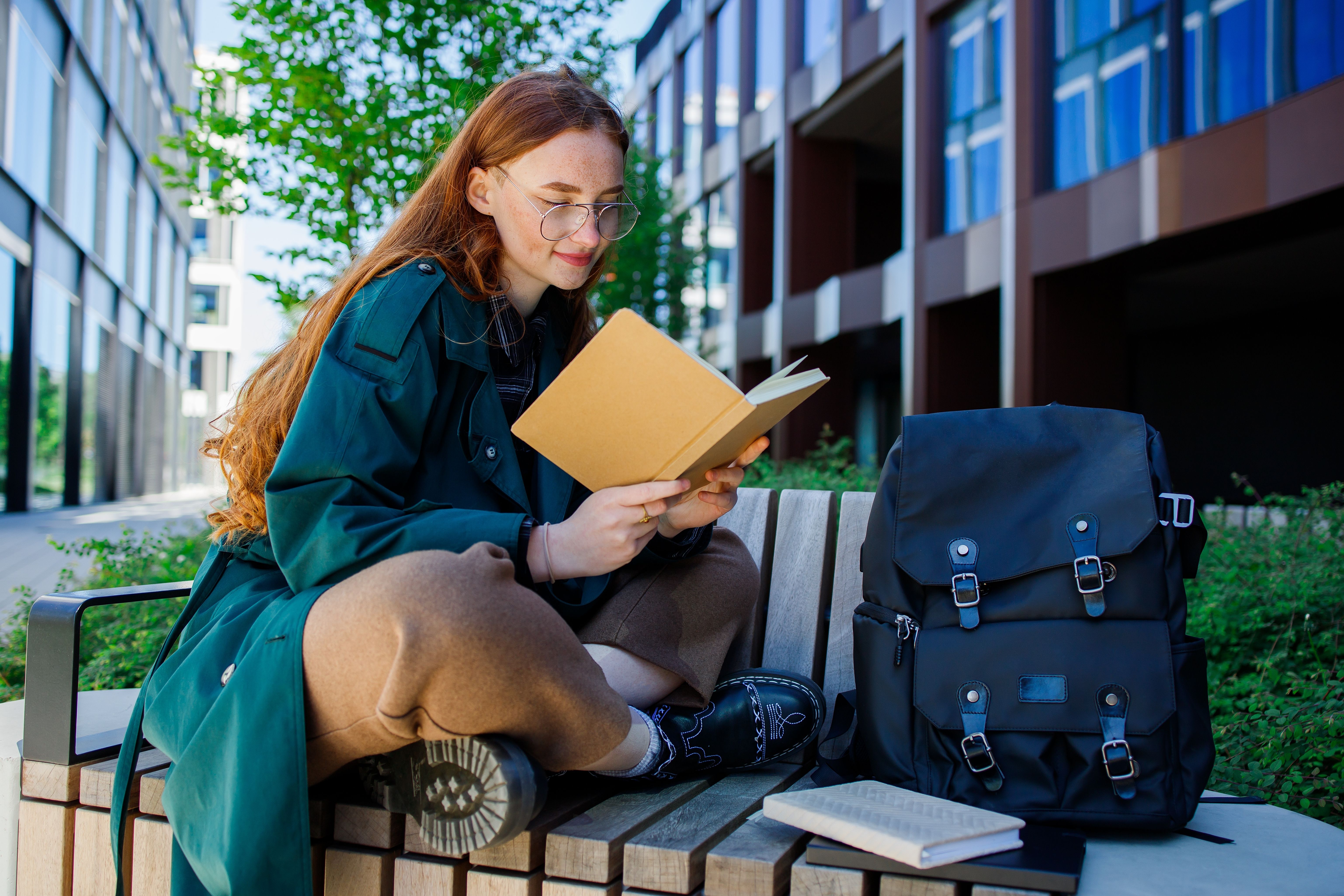 Woman reading a book on English pronunciation