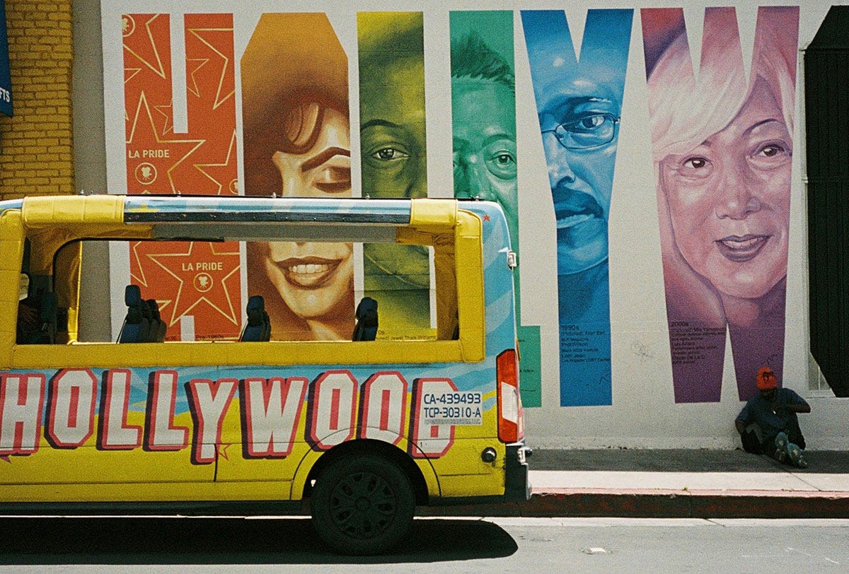 Bus in front of a Hollywood mural