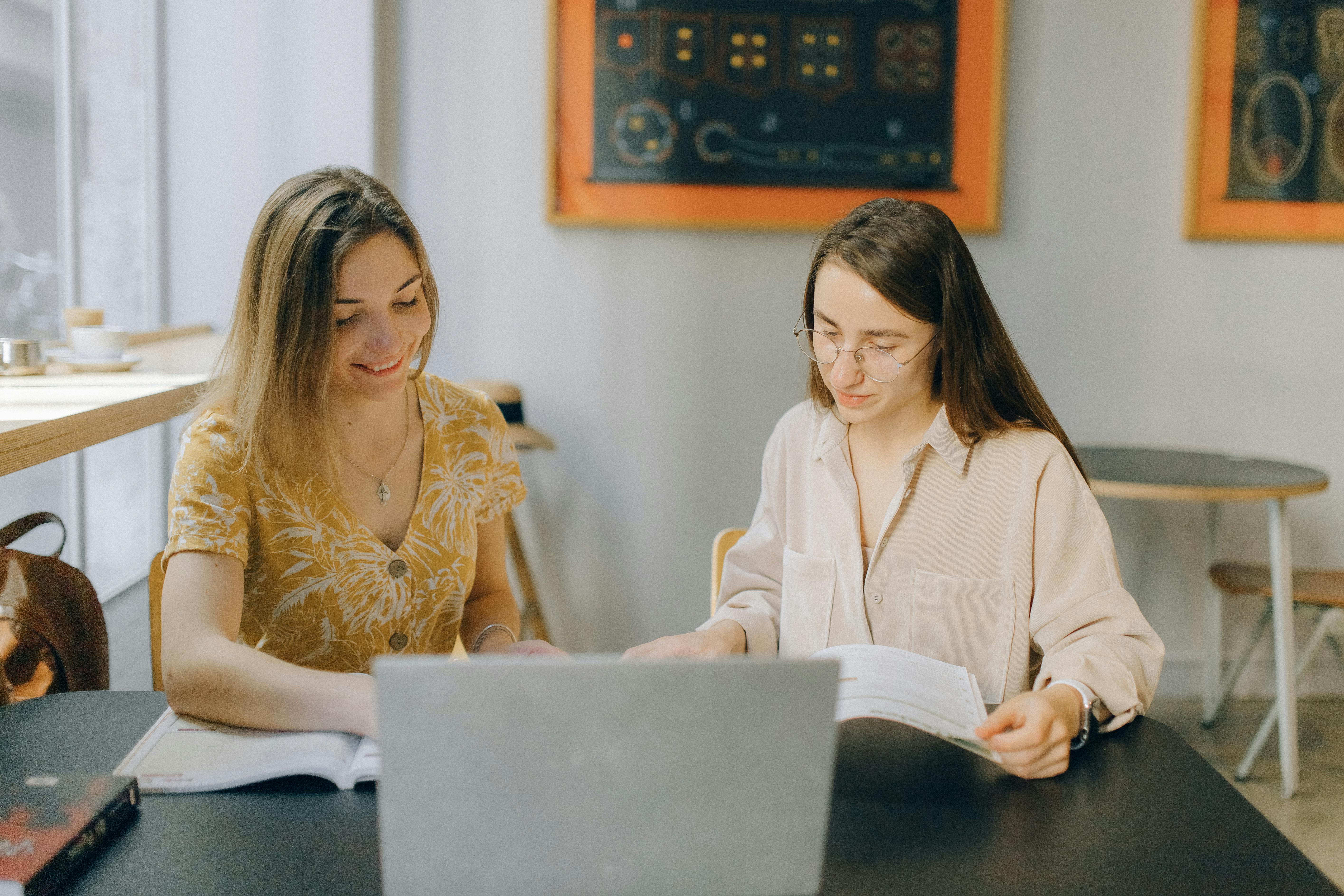 Woman with her instructor practicing future simple tense in English