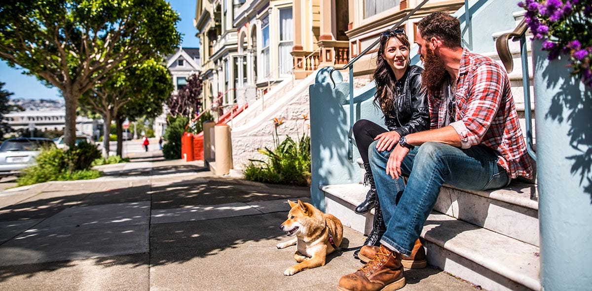 Couple having a conversation while sitting on stairs