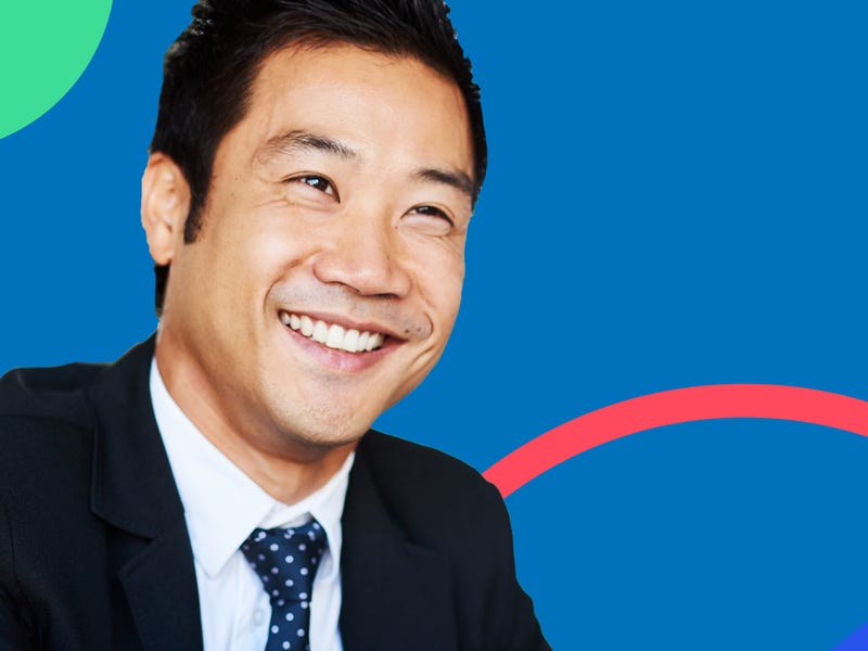 Man shaking hands with an HR person after a successful job interview