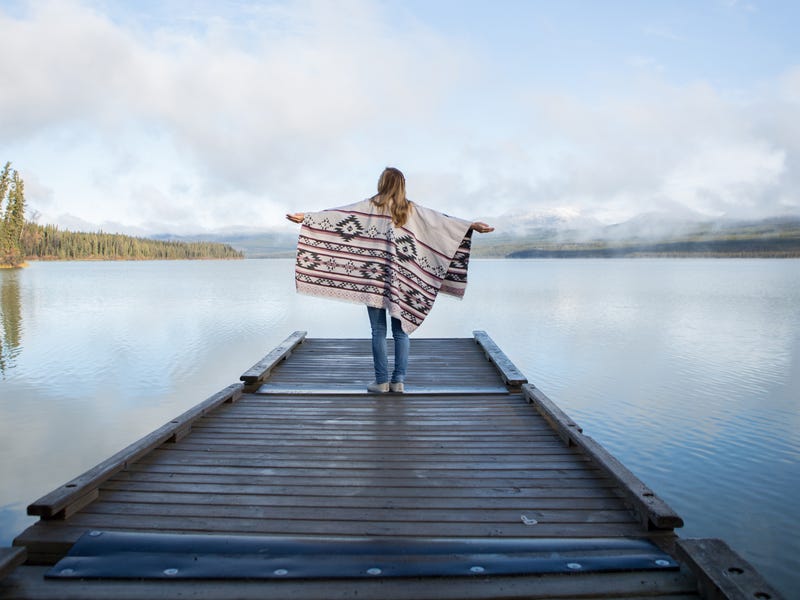 Woman at a lake after learning about the months in French