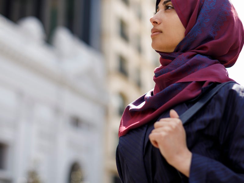 Woman in a city after learning about the days of the week in French