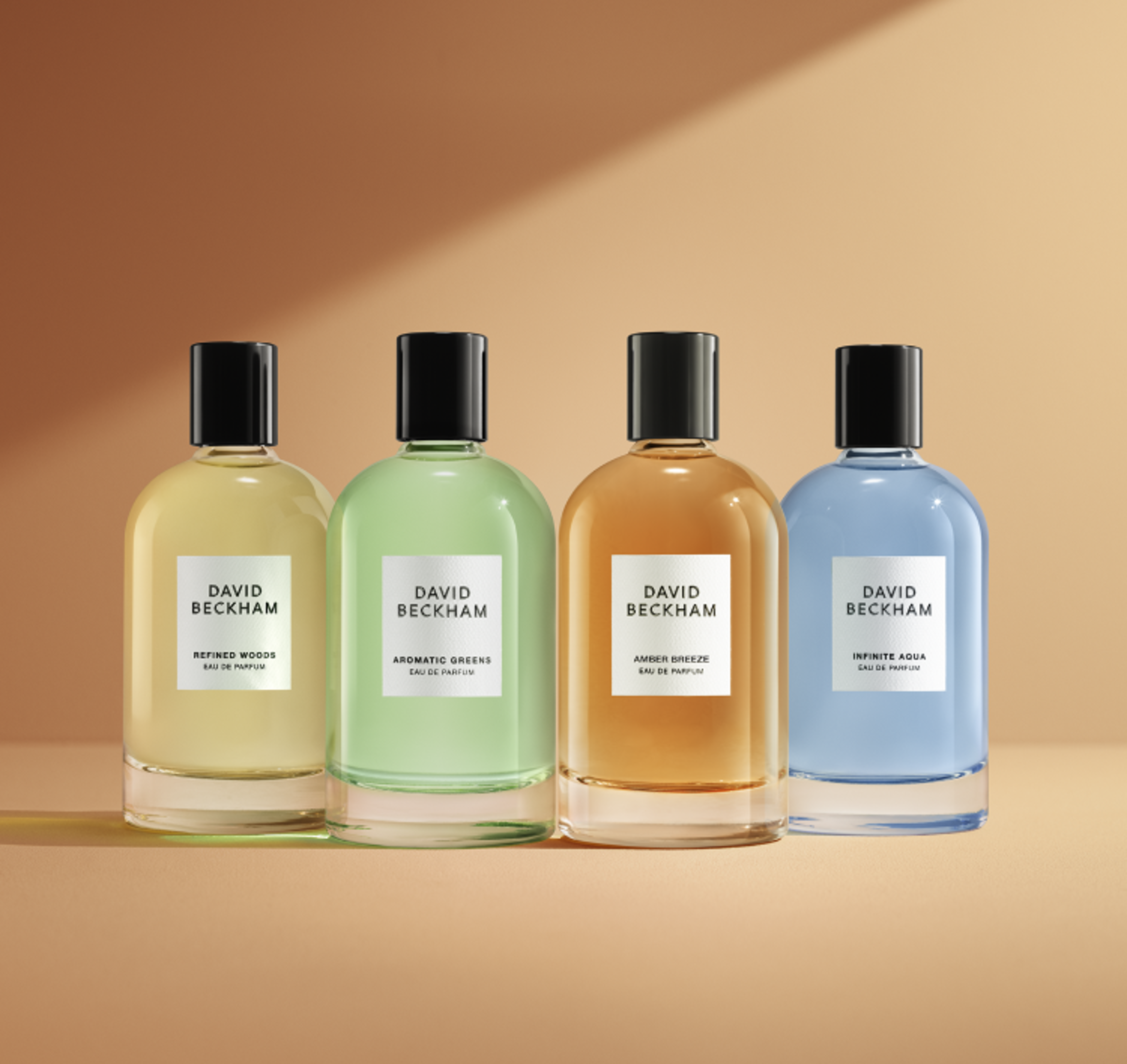 David Beckham Eau de Parfum collection featuring Refined Woods, Aromatic Greens, Amber Breeze, and Infinite Aqua bottles.