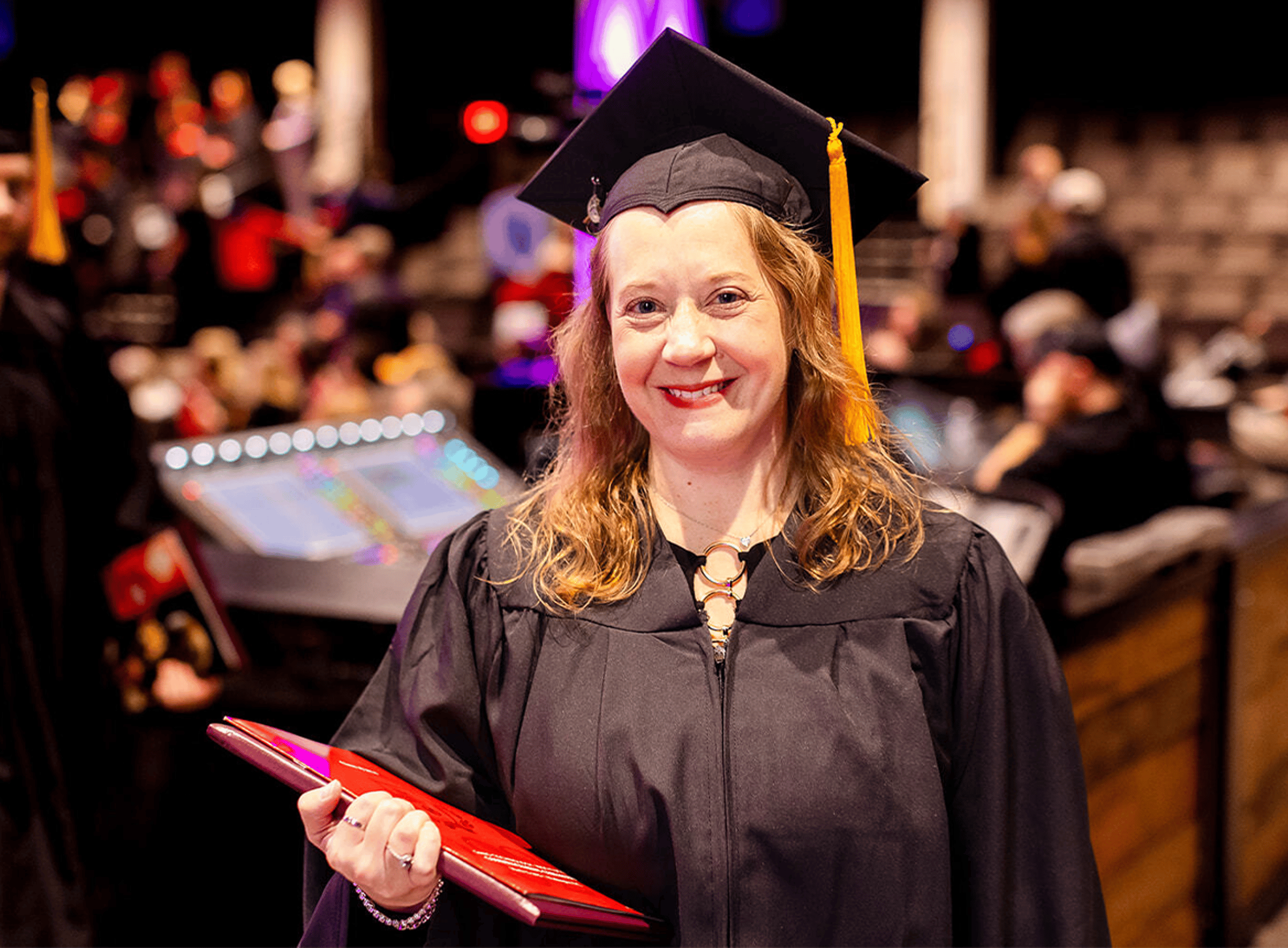 Graduate Smiling at Graduation Ceremony
