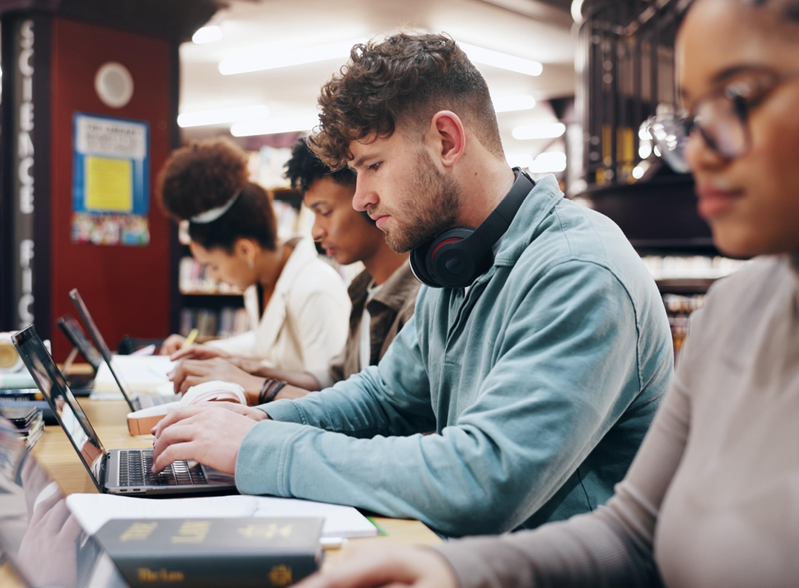 Students Typing on Laptops