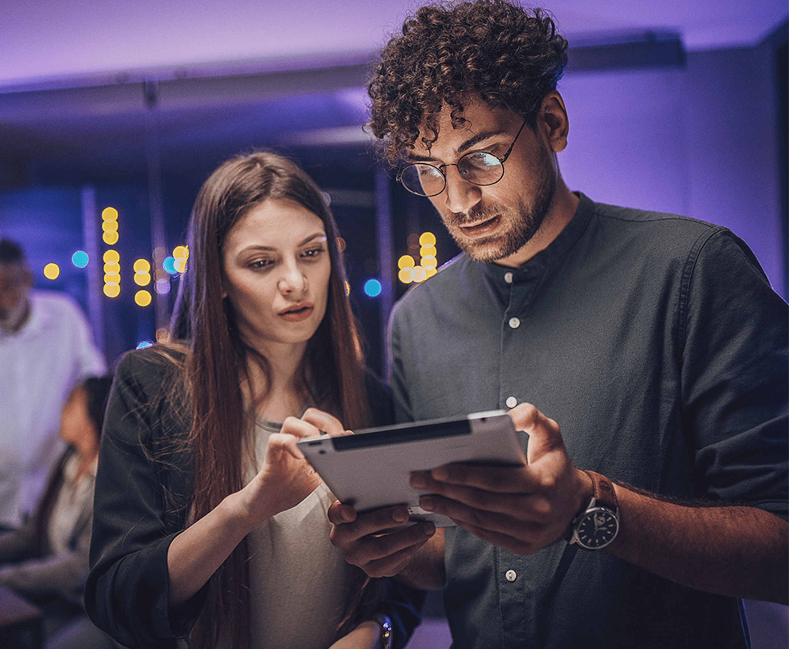Two people working on a laptop