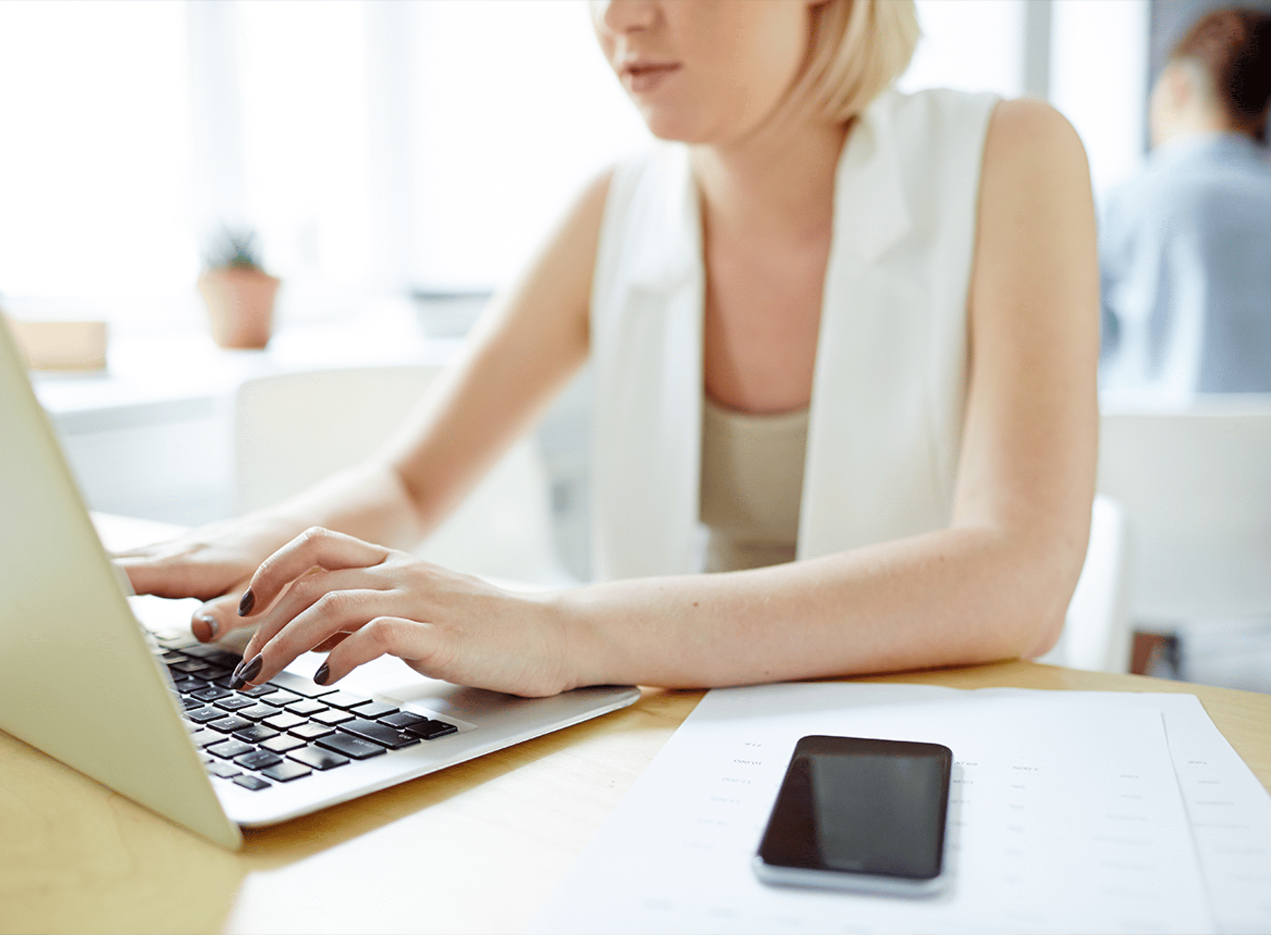 Blonde Woman in White Vest Using Laptop