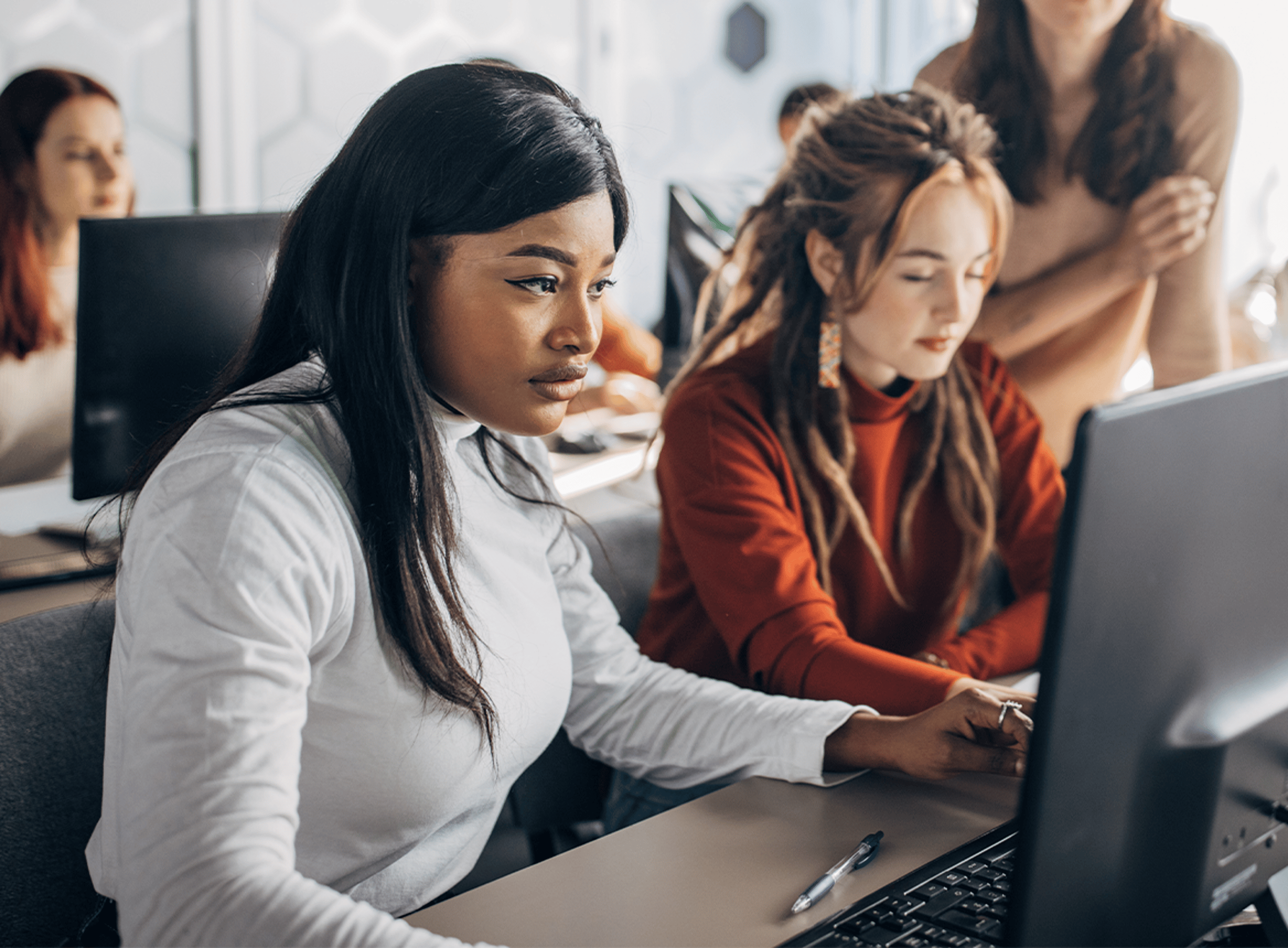 Two Women Working at a Laptop
