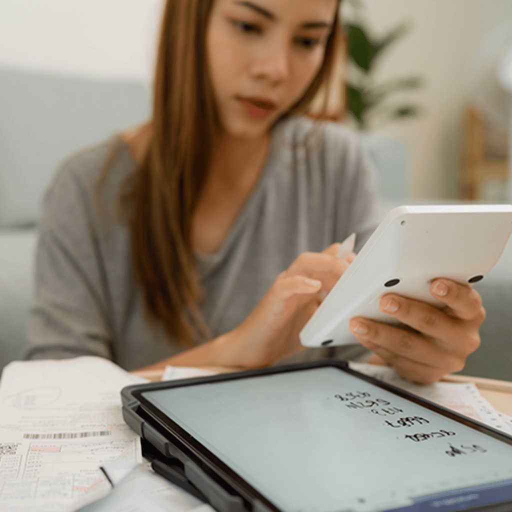 Woman at desk with tablet device