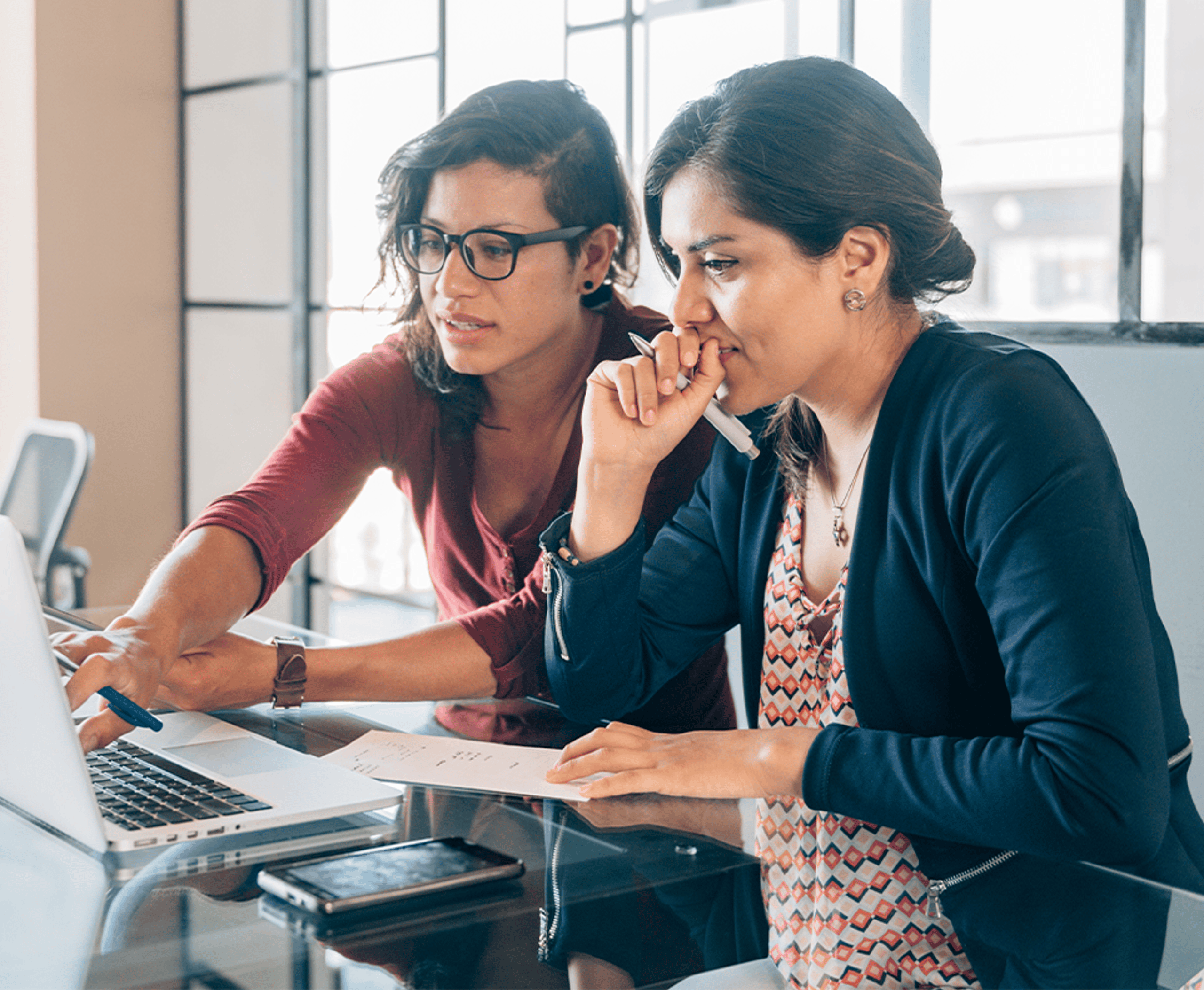 Two women studying on a laptop