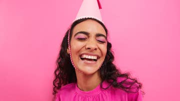women wearing pink party hat