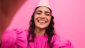 women wearing a pink party hat