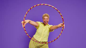 man holding a hula hoop