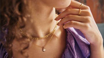 gold necklace with a initial pendant