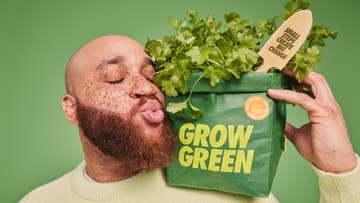 man holding a a grow green veg bag