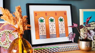 colourful print leaning on sideboard