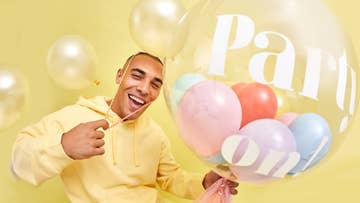 Man holding a large party balllon