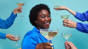 women holding wine glass
