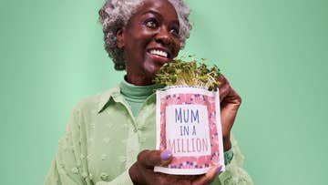lady holding planter which says 'mum in a million'