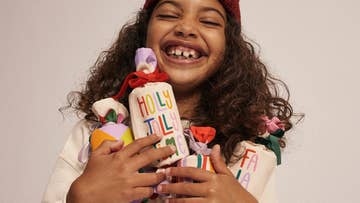 girl holding christmas crackers