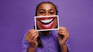 woman holding a smiling picture