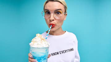 women drinking from a straw