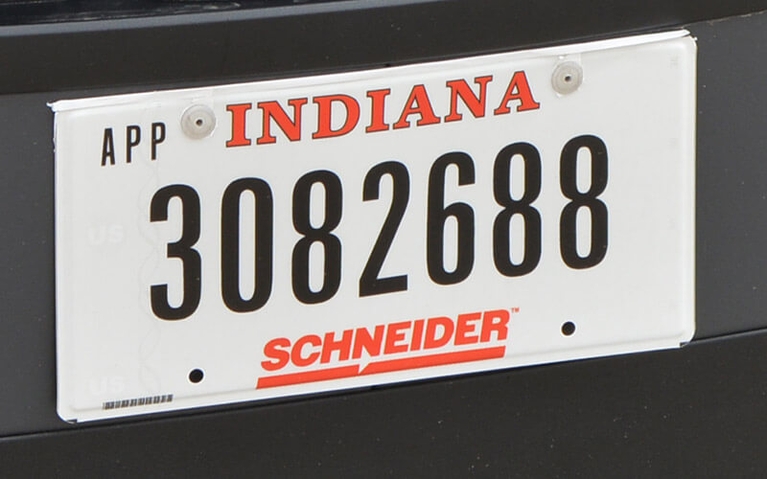 An Indiana license plate with the number 3082688 and Schneider logo on it.