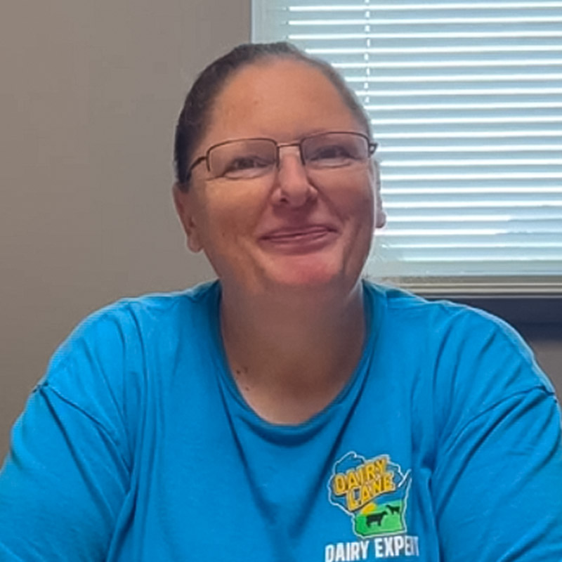 an owner-operator wearing a blue t-shirt and rectangular glasses
