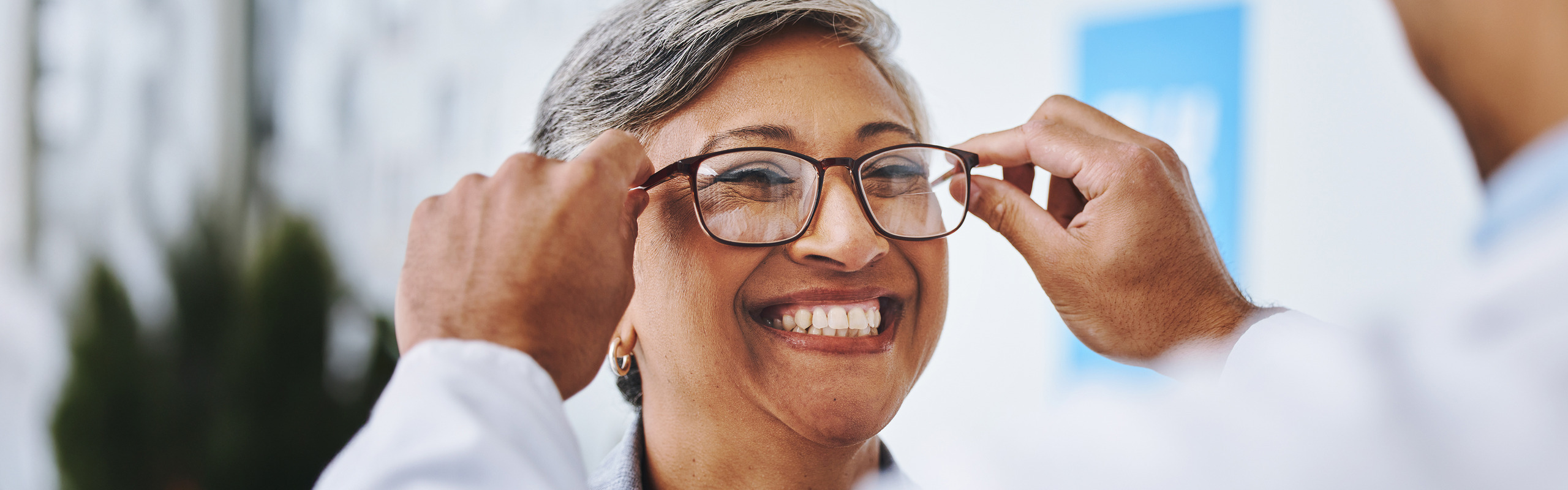 Woman trying on glasses