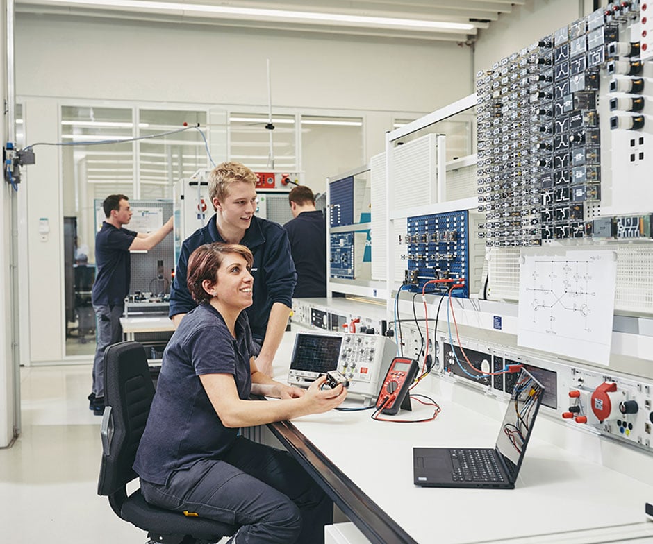 peopel working in a control room