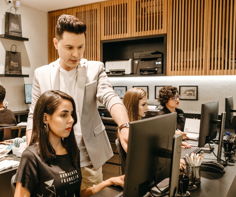 Two people working on a computer