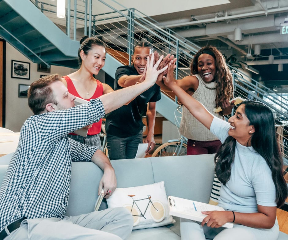 people high fiving one another