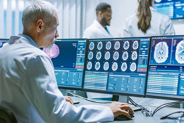 a doctor working on medical monitors