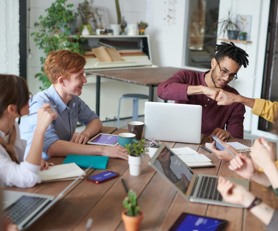 group of people sitting and working together