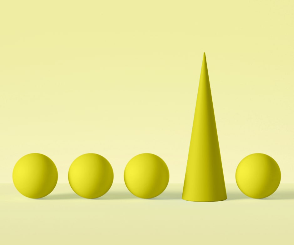 4 yellow spheres horizontally aligned with a yellow cone between the 3rd and 4th sphere all in front of yellow background