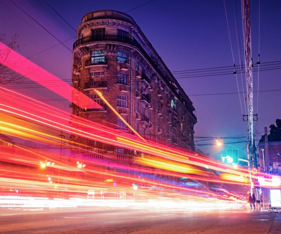 fast traveling light in front of building