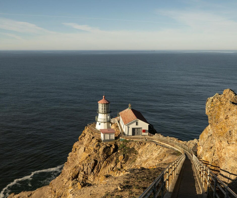 House on cliff sitting above water