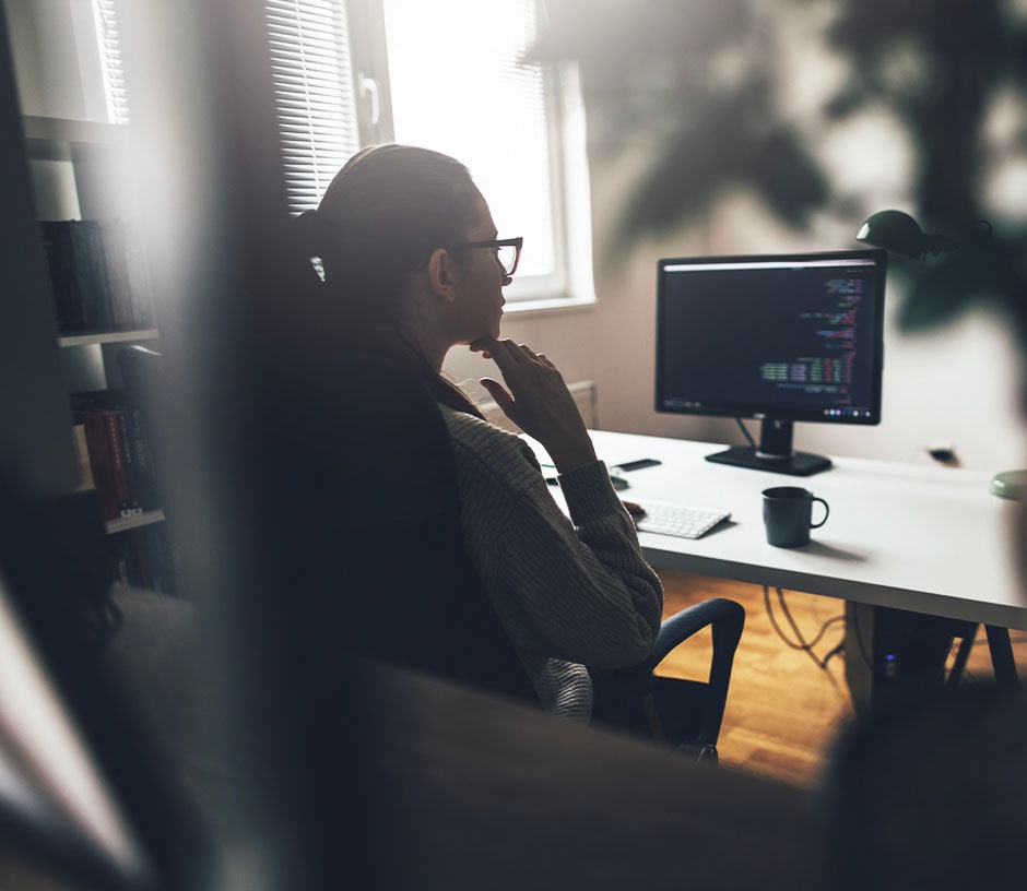 woman sitting in front of computer