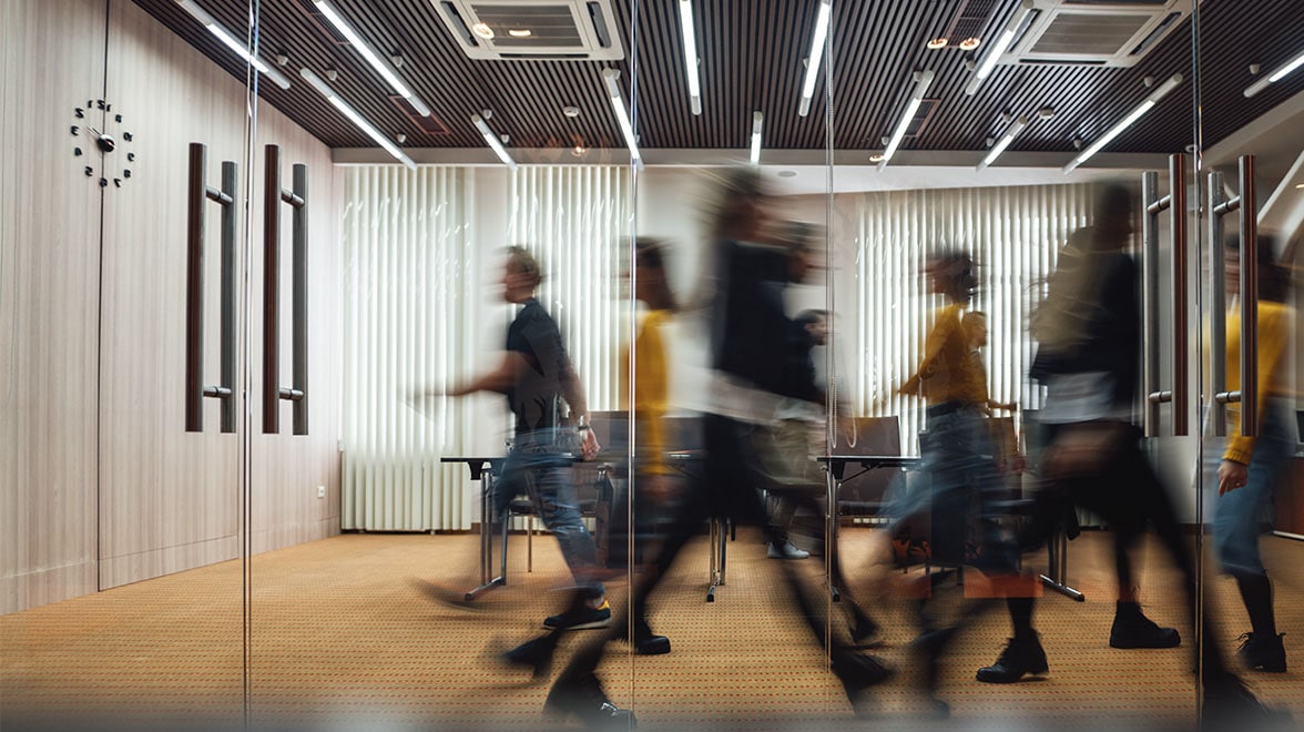ai leaders walking across inside the building