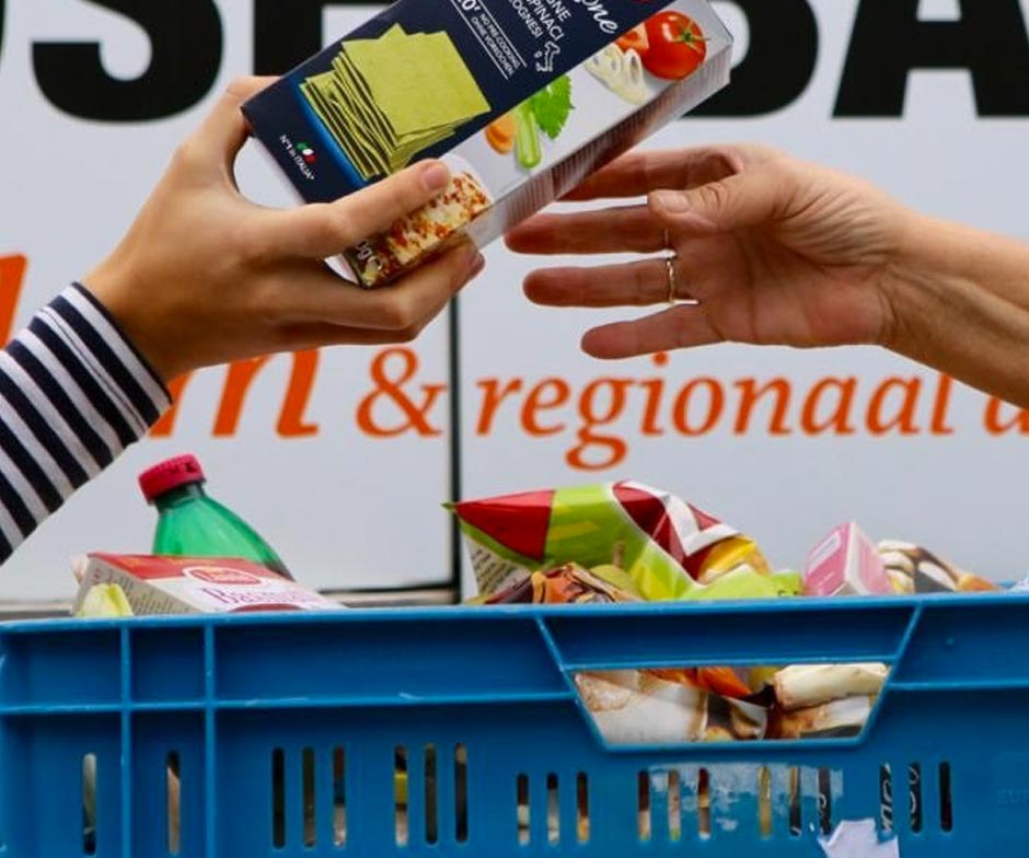 a person giving food to another person