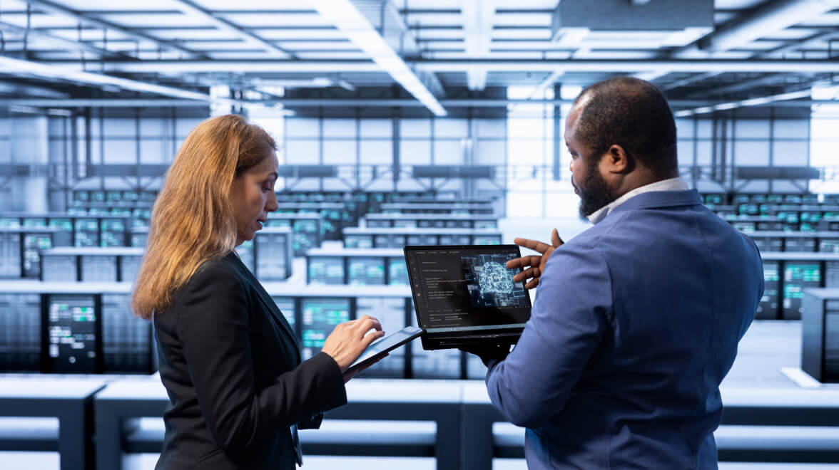 Man and woman looking at their devices