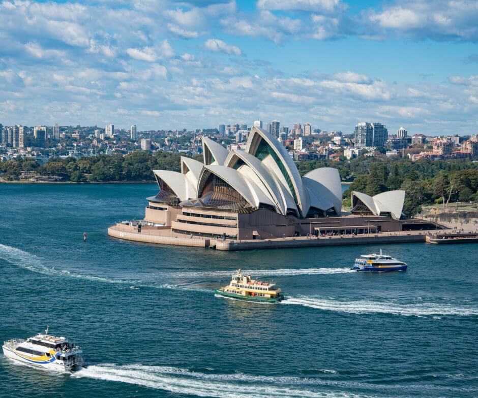 Sydney Opera House with boats on the harbor