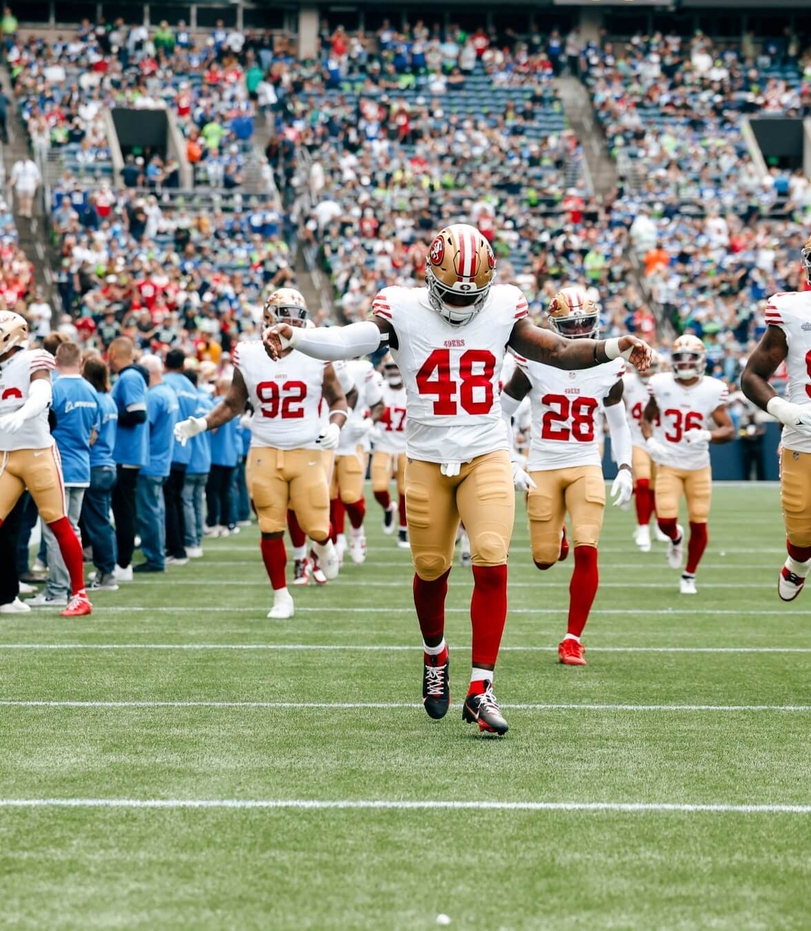 San Francisco 49ers running on the field