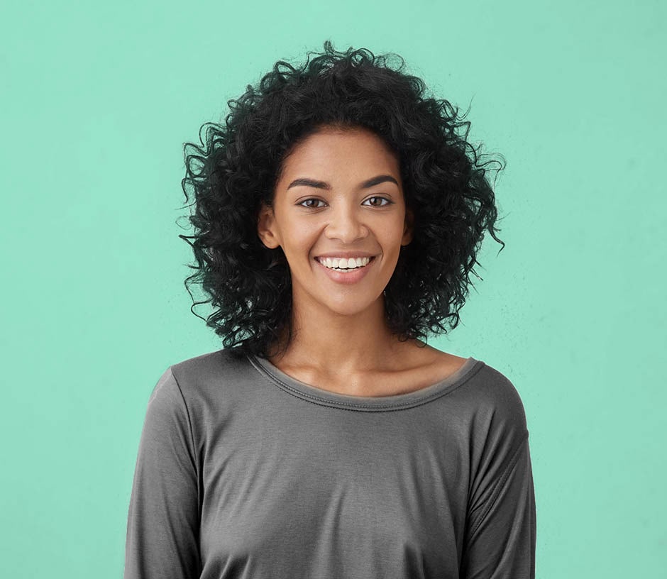 woman smiling on green background