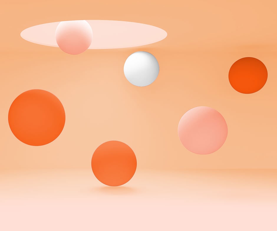 multi colored balls falling from a hole in the ceiling