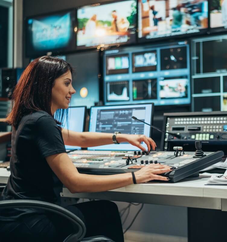 Woman working in a broadcast control room