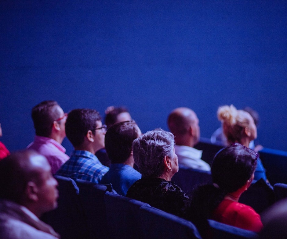 Audience sitting in chairs