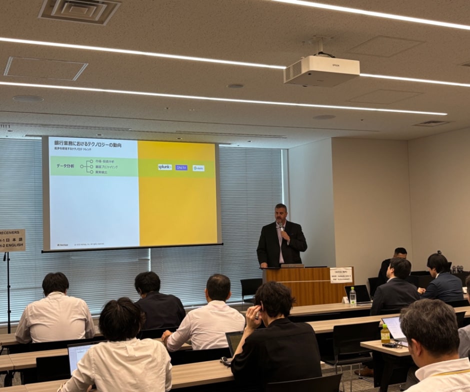 professor showing slides to the class and talking on mic